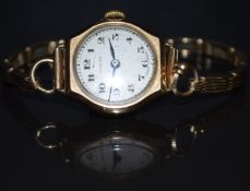 Vertex 9ct gold ladies wristwatch with blued hands, black Arabic numerals, silver dial and signed 15