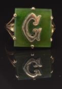 A 9ct gold signet ring set with a nephrite jade plaque with gold letter 'G' to the centre, size P,