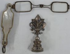 A silver and mother of pearl lorgnette with vacant gold panel to side, length when open 12cm,