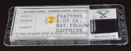 A loose natural 1.07ct yellow sapphire with certificate