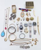 A collection of costume jewellery including rolled gold bangle, silver including pendant set with