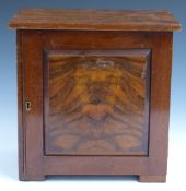 A walnut collector's cabinet with two over four straight drawers behind a door, W29 x D20 x H29cm