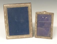 Two hallmarked silver photograph frames the larger to suit 7 x 5 inch photo, both with easel backs