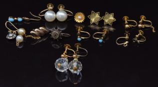 A collection of 9ct gold earrings including a pair set with faux pearls, another pair set with beads