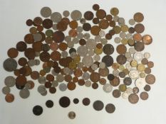 A small interesting collection of UK and overseas coinage to include two Charles II farthings 1672