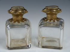 Pair of French perfume bottle with gilt lids, each with a grand tour painting to top, height 7.5cm