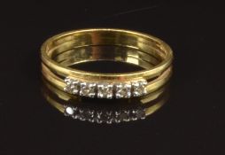 An 18ct gold ring set with five diamonds, size N, 2.4g