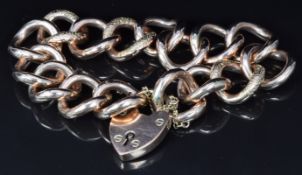 A 9ct rose gold curb link bracelet made up of alternating engraved and smooth links, 29g