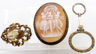 Victorian magnifying glass, large Victorian brooch set with a cameo and another Victorian brooch set