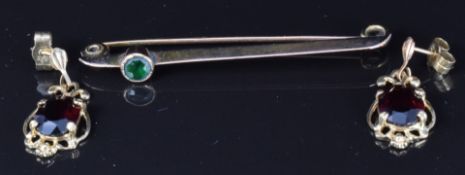 A pair of 9ct gold earrings set with garnets and a bar brooch, 5.4g