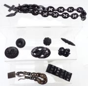 A collection of Victorian jet/ vulcanite jewellery including carved brooches, bracelet and necklaces