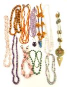 A collection of beaded necklaces including amethyst, agate, malachite, rhodochrosite, amber and rose