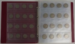 A collector's album containing a large number of UK half crowns 1922-29, approximately 2850g in