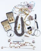 A collection of costume jewellery including cufflinks, silver brooch, silver pendant, necklaces,