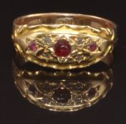 Edwardian 18ct gold ring set with three garnets and diamonds, size M, 2.6g