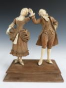 19thC continental finely carved wood and ivory figure of a lady and gentleman dancing, in the manner