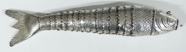 Articulated white metal novelty fish with red cabochon eyes, length 18cm, weight 67g