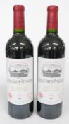 Two bottles of Chateau Grand-Puy-Lacoste 2000 Pauillac Grand Cru Classé red wine 75cl 13% vol.