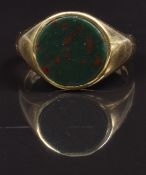 A 18ct gold signet ring set with blood stone, size M, 7.2g