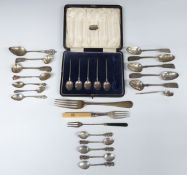 A collection of hallmarked sterling silver and white metal flatware including a pair of Victorian