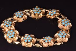 An 18ct gold bracelet set with faux turquoise in flower settings, 13.5g