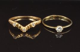 Two yellow metal rings set with paste, sizes R & U, 2.7g