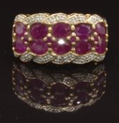 A 9ct gold ring set with oval cut rubies and diamonds, size O, 4.2g