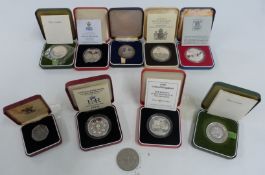 Nine various Royal Mint proof silver and proof crowns etc, all cased, most with certificates