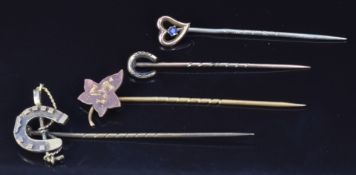 Victorian silver stick pin in the form of a horseshoe and riding crop, a 9ct gold stick pin set with