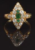 Victorian 18ct gold ring set with one square cut and two round cut emeralds, surrounded by old cut
