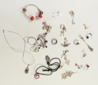 A collection of silver jewellery including earrings, necklaces, bracelets, titanium ring, etc