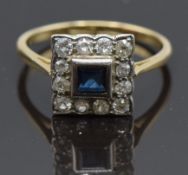An 18ct gold ring set with a square cut sapphire surrounded by diamonds, size N, 3g