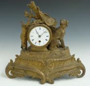 French brass figural mantel clock featuring a hunting dog and hare, the enamel Roman dial with