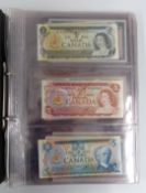 A collection of banknotes in a folder, to include Canada, Scotland, Clydesdale, UK,  Hong King and