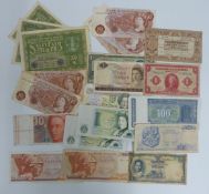 A small collection of World and UK banknotes including 1919 German, New Zealand, Jersey, Holland,