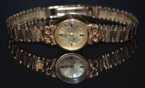 Rotary 9ct gold ladies wristwatch with two-tone gold and black hands, gold hour markers and dial and