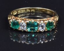 Edwardian 18ct gold ring set with three square cut emeralds and two old cut diamonds, Chester