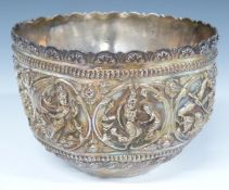 Indian or Burmese white metal bowl with embossed decoration of deities including playing instruments