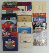 Twenty-three Royal brilliant uncirculated UK coin sets in presentation packs, 1982-2004
