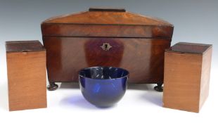 19thC flame mahogany sarcophagus shaped tea caddy with Bristol blue glass mixing bowl, raised on bun