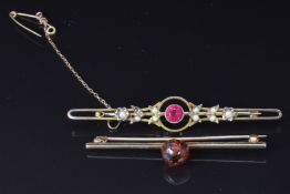 Two 9ct gold brooches, one set with amber the other with paste and seed pearls, 5.9g