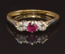 A 9ct gold ring set with a round cut ruby and two round cut diamonds, size L, 2.2g