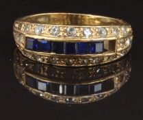 A 9ct gold ring set with square cut sapphires and paste, size O, 2.7g