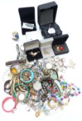 A collection of costume jewellery including silver locket, pocket watch inset with a platinum