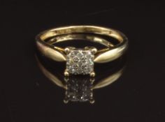 A 9ct gold ring set with diamonds in a square setting, size O, 1.7g