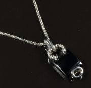 An 18ct white gold pendant set with onyx and diamonds on 18ct white gold chain, 6.4g, length 38cm