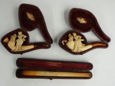 Two Meerschaum pipes and a cheroot holder, all in original boxes