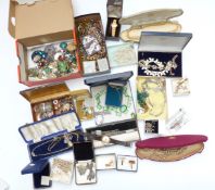 A collection of costume jewellery including beads, silver and marcasite brooches, filigree earrings,