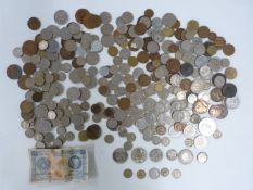 A quantity of UK and overseas coinage, includes a George II halfpenny, some silver and a 1958 '