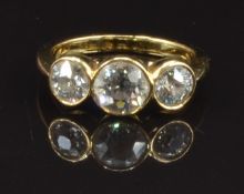 An 18ct gold ring set with three round cut diamonds of approximately 0.8ct, 0.4ct and 0.4ct, size L,